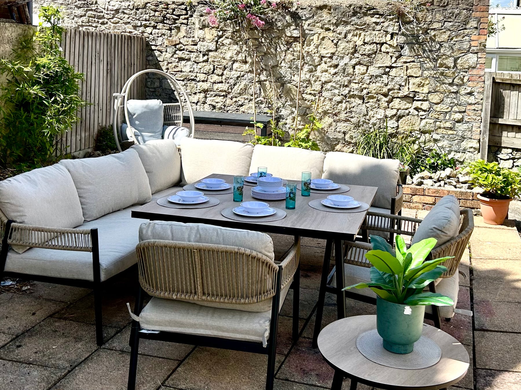 Sunny garden seating and outdoor dining at Sweet Cottage
